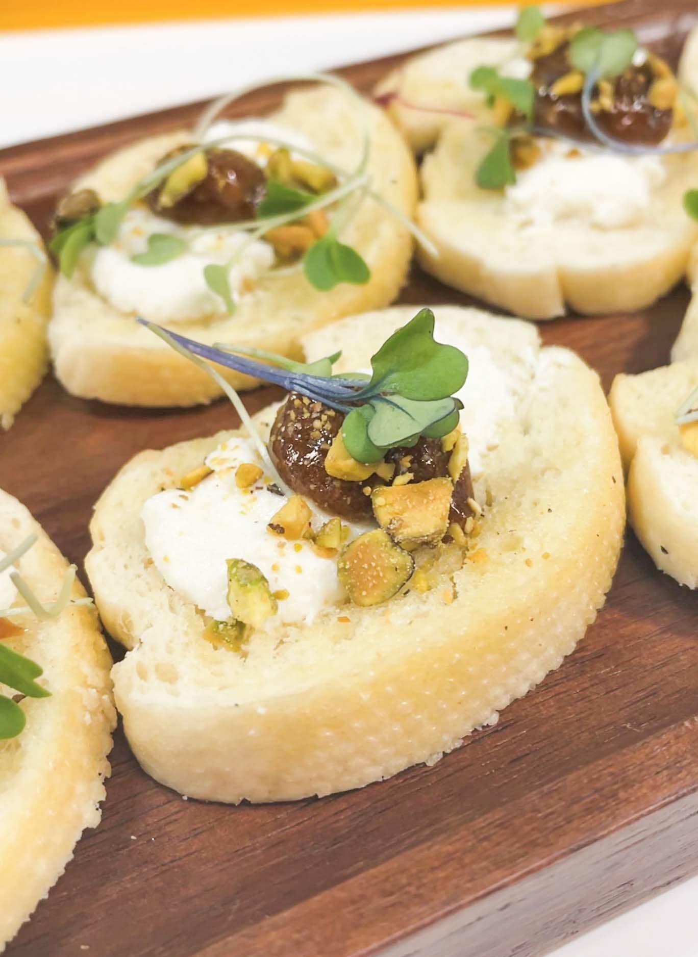 GOAT CHEESE AND PISTACHIO CROSTINI WITH FIG JAM